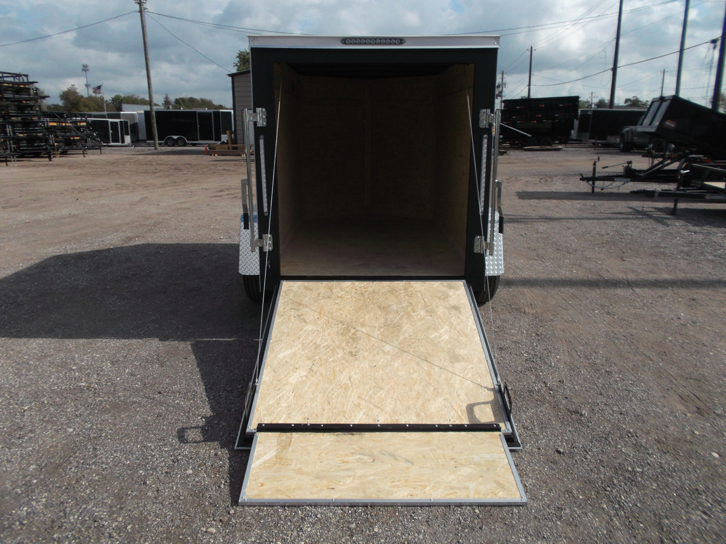 New 2026 Covered Wagon Trailers 5x8 Single Axle Cargo Trailer / Enclosed Trailer / Ramp / LED's / .030 Black Semi-Screwless Exterior / Bed Lined Tongue and Frame