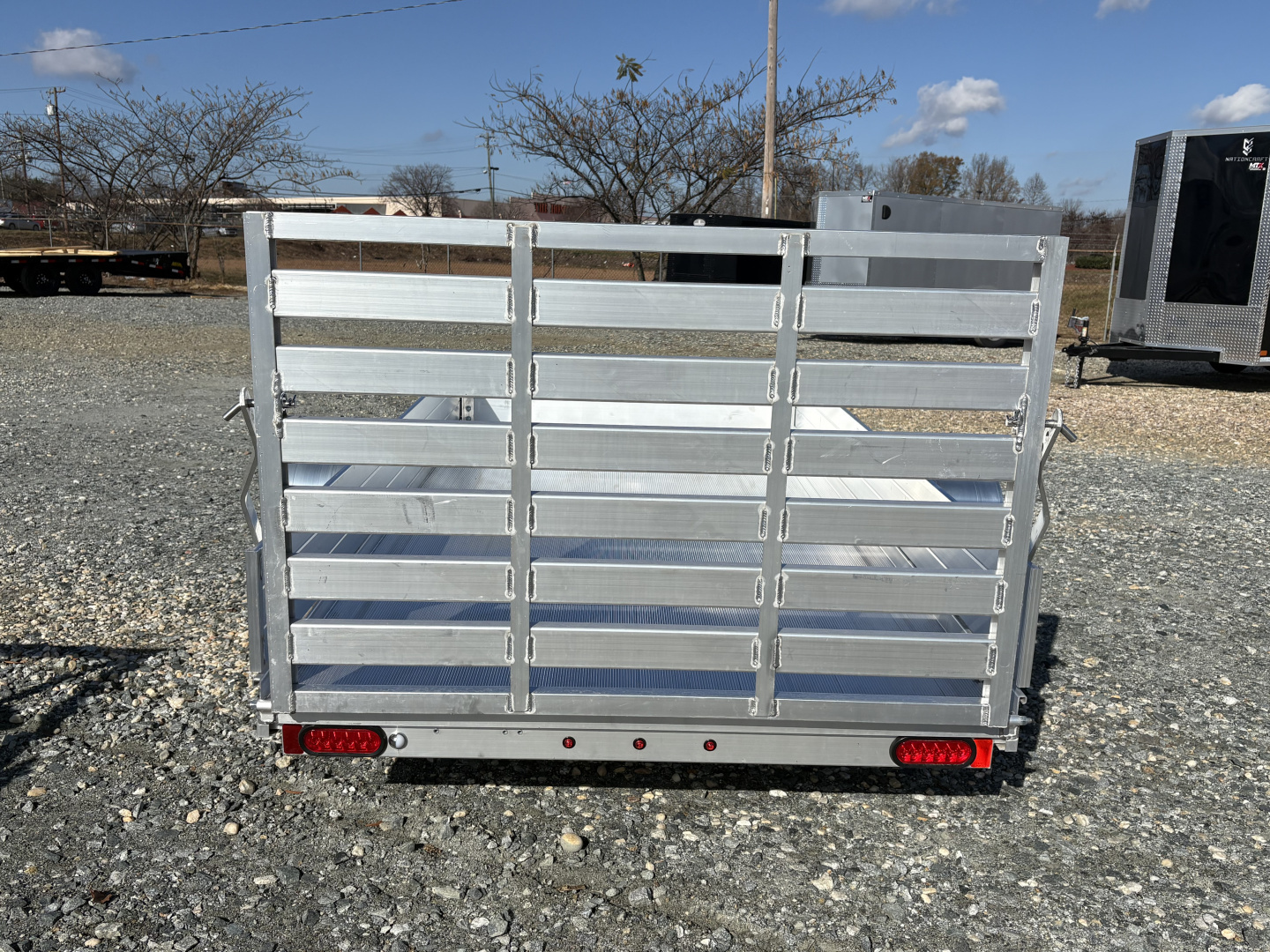 New 2026 Aluma 6310 w/ 12" Solid Sides and Gate Utility Trailer