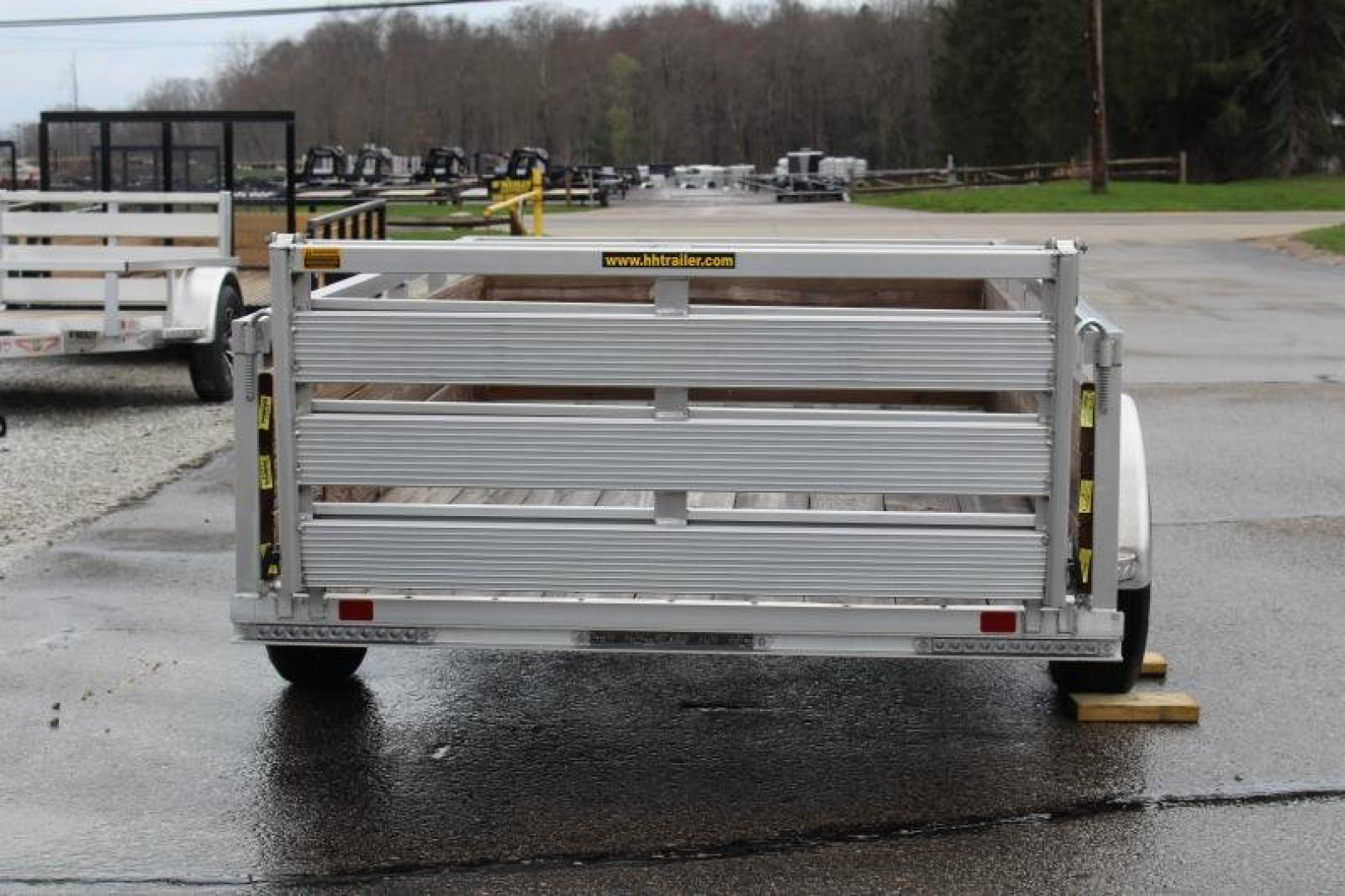 New 2026 H & H 5' 5" x 10' Aluminum Wood Side Utility Trailer - BiFold Ramp - 2990# GVW