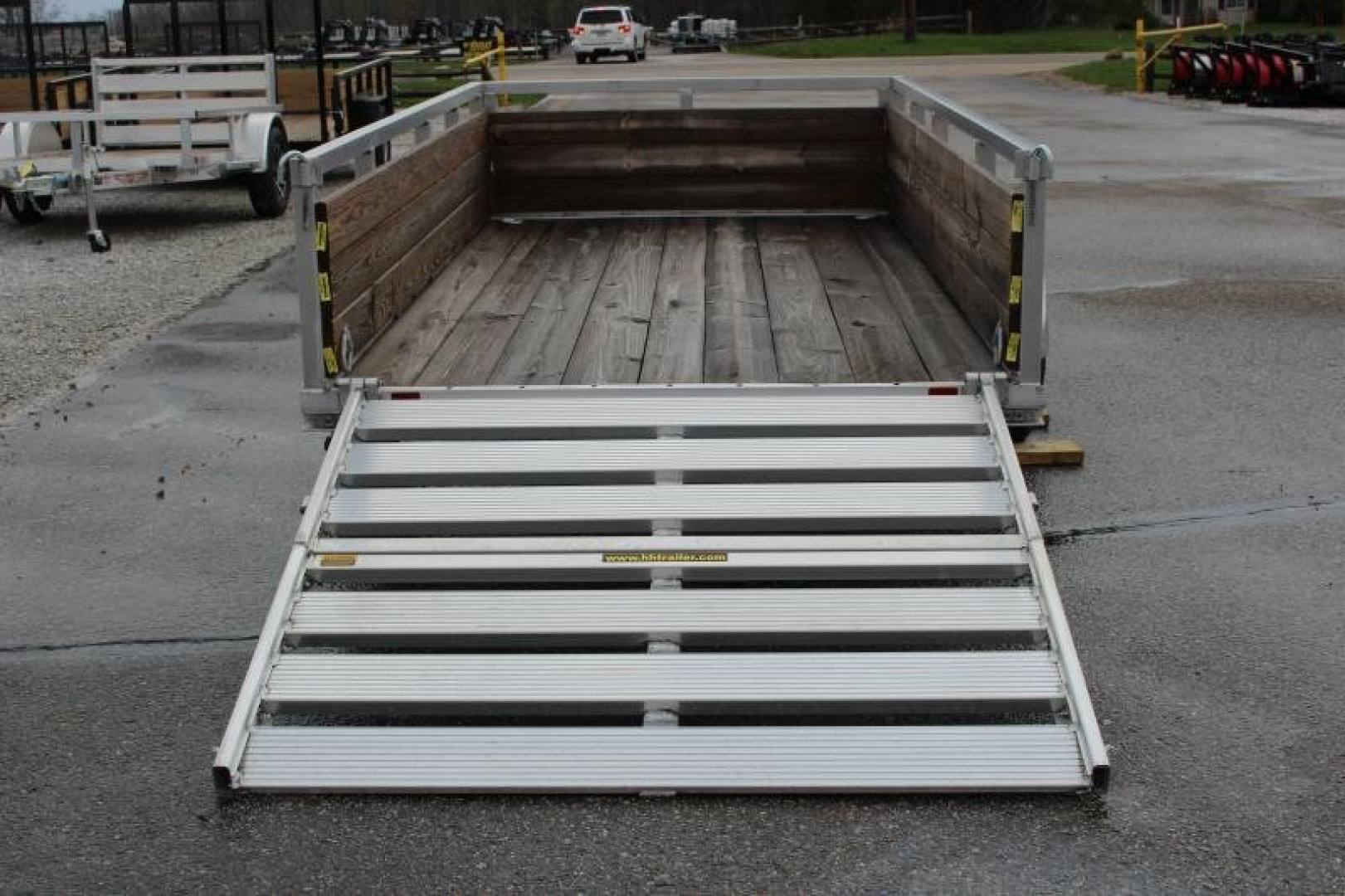 New 2026 H & H 5' 5" x 10' Aluminum Wood Side Utility Trailer - BiFold Ramp - 2990# GVW