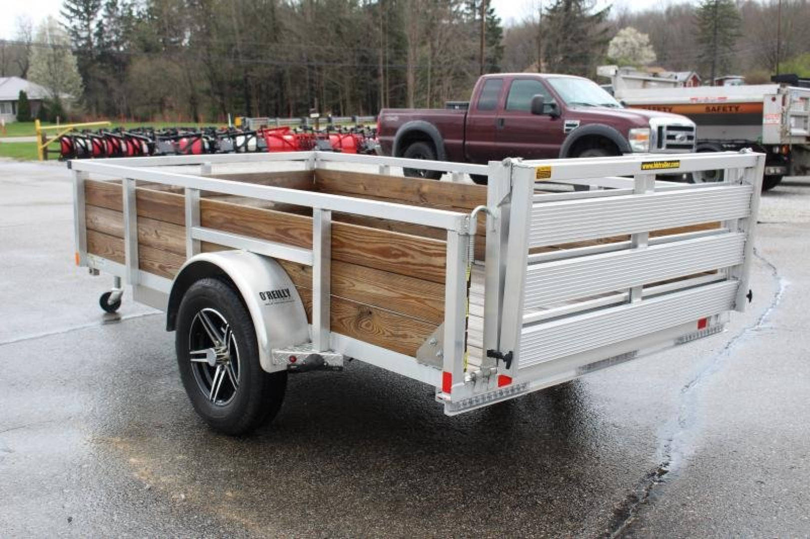 New 2026 H & H 5' 5" x 10' Aluminum Wood Side Utility Trailer - BiFold Ramp - 2990# GVW