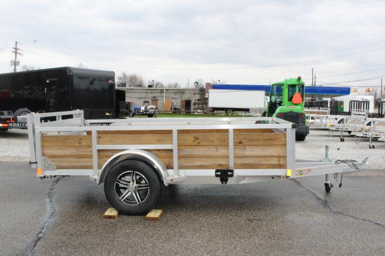 New 2026 H & H 5' 5" x 10' Aluminum Wood Side Utility Trailer - BiFold Ramp - 2990# GVW