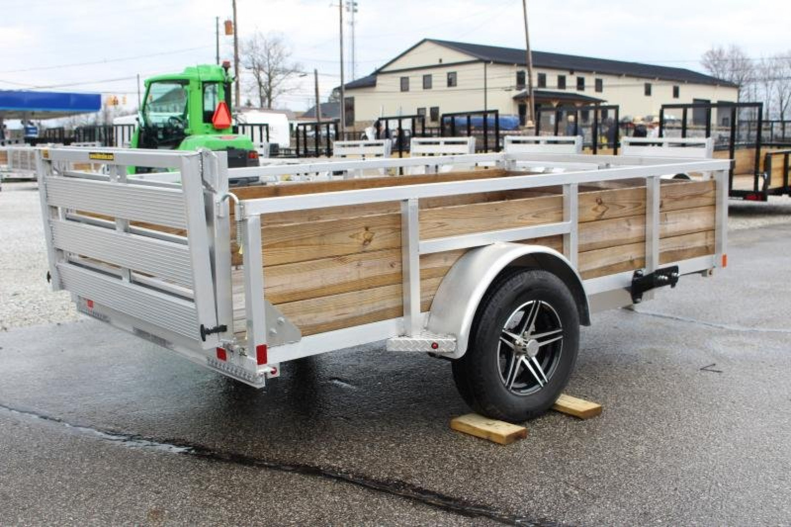 New 2026 H & H 5' 5" x 10' Aluminum Wood Side Utility Trailer - BiFold Ramp - 2990# GVW