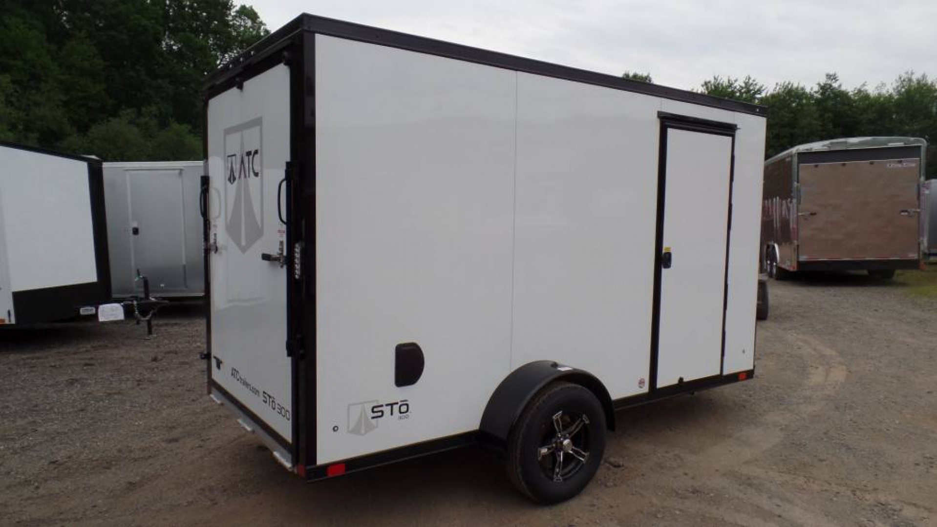 New ATC Aluminum Enclosed Cargo Trailer 6X12, 66 interior height, White with Black Trim Pkg., Ramp Door, SALE $7,995.  #231404