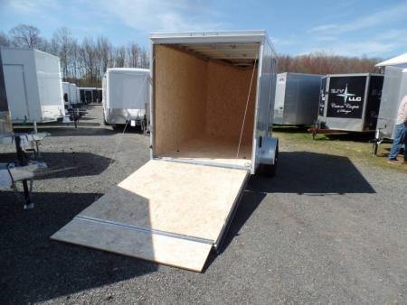 New EXAMPLE / ATC BRAND , ALUMINUM FRAME 6X10 Cargo Trailer, 66 interior height, 2,990 lb. GVWR, Ramp Door, Side Door, V Nose, 1,194 lbs. empty weight ID# 233601