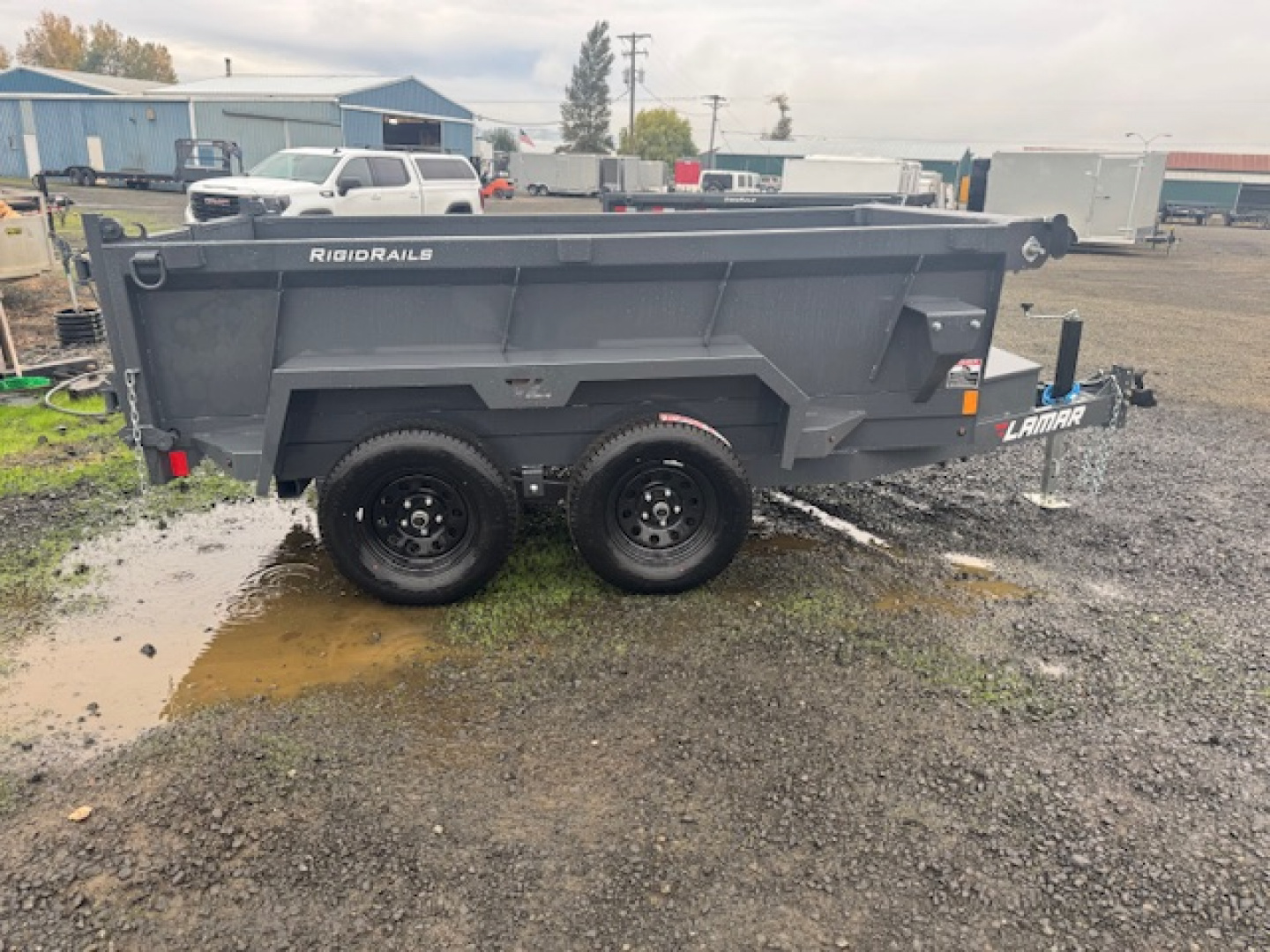 New 2026 LAMAR TRAILERS 60" x 10' DS23 Tandem Axle 7K Dump Trailer