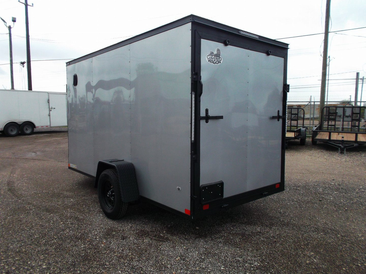 New 2026 Covered Wagon Trailers 6x10 Cargo / Enclosed Trailer / 6'6" Interior / Extra Wide Ramp / RV Side Door / LEDs / .030 Silver Semi-Screwless Exterior / Black Out Package