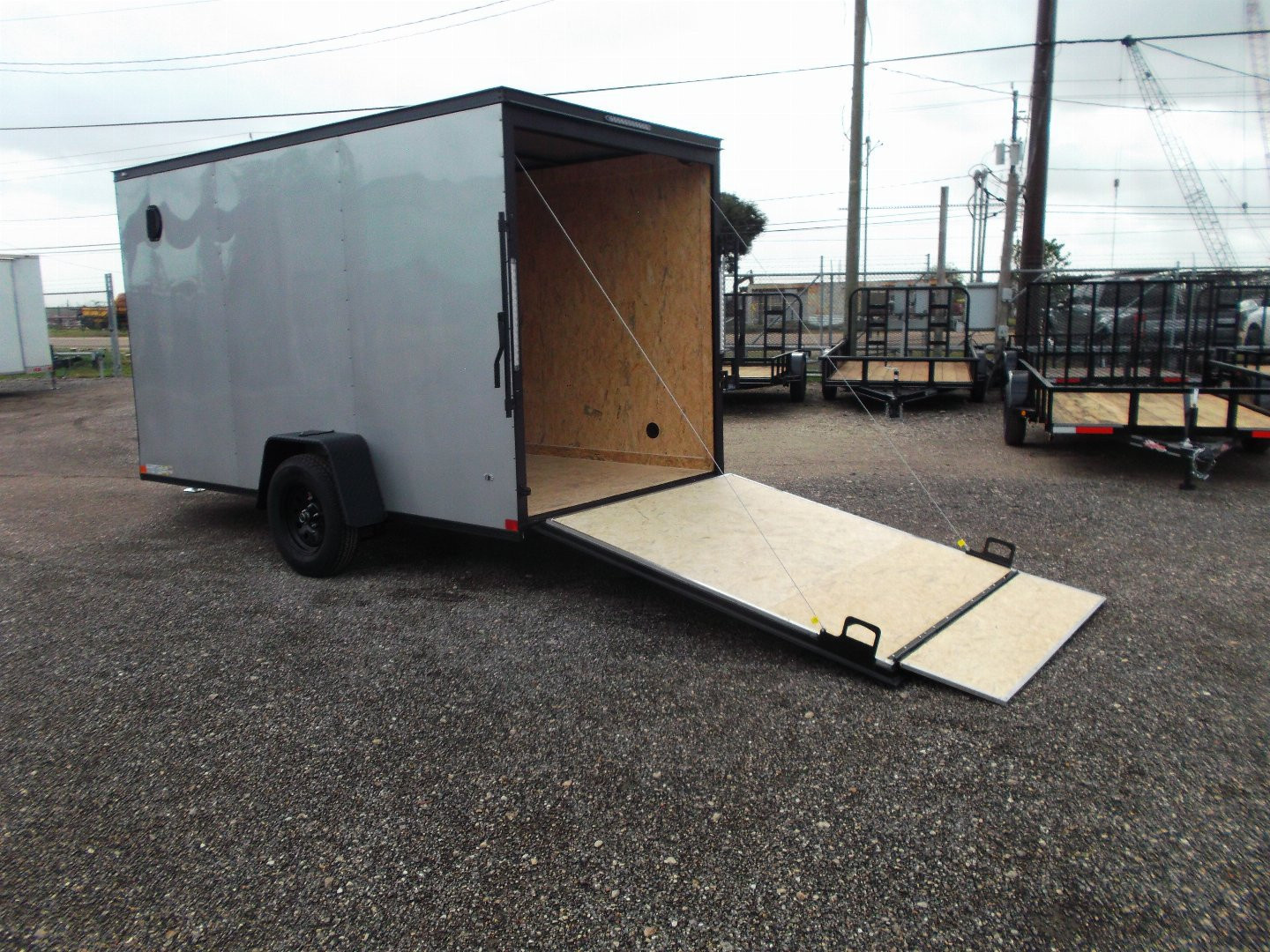 New 2026 Covered Wagon Trailers 6x10 Cargo / Enclosed Trailer / 6'6" Interior / Extra Wide Ramp / RV Side Door / LEDs / .030 Silver Semi-Screwless Exterior / Black Out Package
