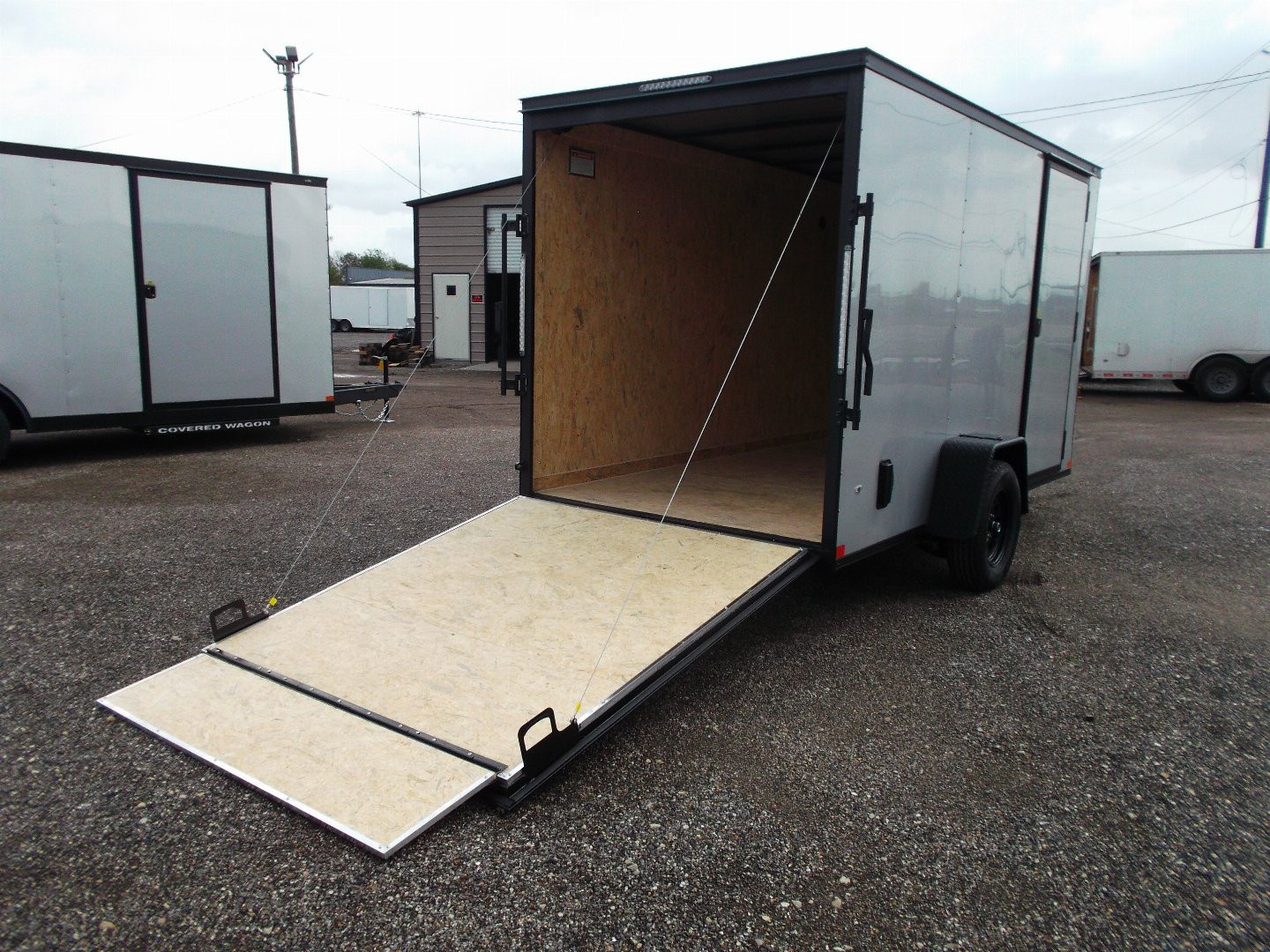 New 2026 Covered Wagon Trailers 6x10 Cargo / Enclosed Trailer / 6'6" Interior / Extra Wide Ramp / RV Side Door / LEDs / .030 Silver Semi-Screwless Exterior / Black Out Package