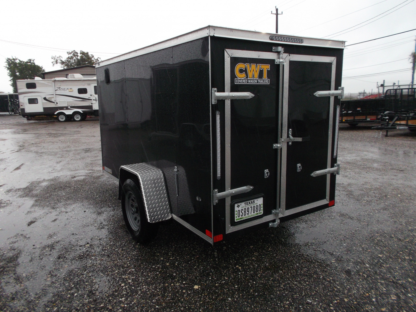 Used USED 2026 Covered Wagon Trailers 5x10 Single Axle Cargo Trailer / Enclosed Cargo Trailer / Double Rear Barn Doors/ RV Side Door / Bed Lined Tongue and Frame / .030 Black Semi-Screwless Exterior