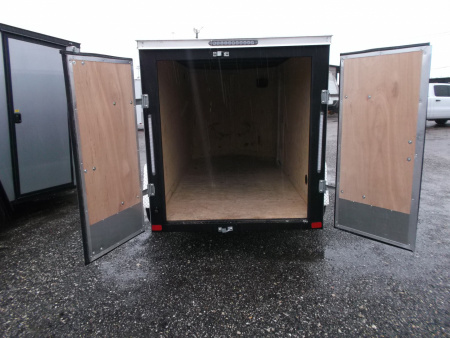 Used USED 2026 Covered Wagon Trailers 5x10 Single Axle Cargo Trailer / Enclosed Cargo Trailer / Double Rear Barn Doors/ RV Side Door / Bed Lined Tongue and Frame / .030 Black Semi-Screwless Exterior