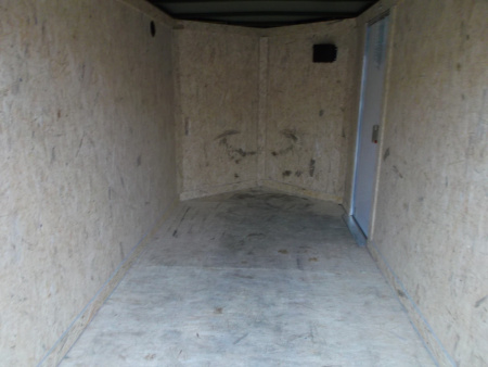 Used USED 2026 Covered Wagon Trailers 5x10 Single Axle Cargo Trailer / Enclosed Cargo Trailer / Double Rear Barn Doors/ RV Side Door / Bed Lined Tongue and Frame / .030 Black Semi-Screwless Exterior