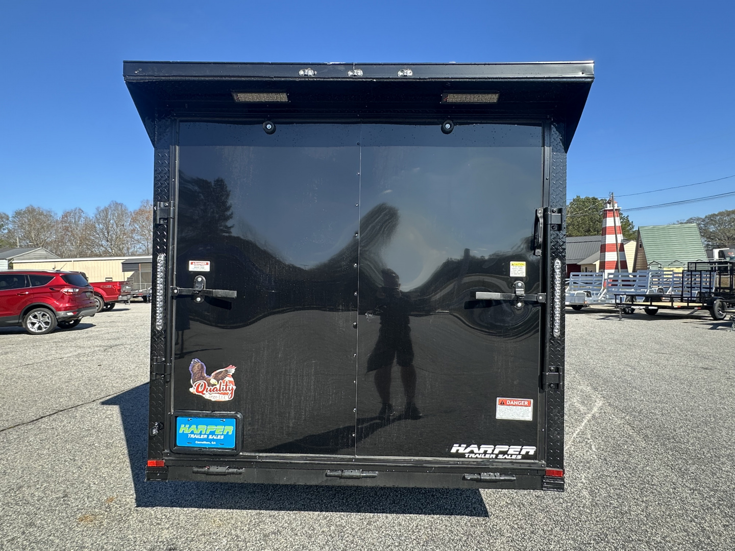 New 2026 7X16 QUALITY CARGO TANDEM AXLE ENCLOSED TRAILER WITH REAR SPOILER AND BLACKOUT PACKAGE