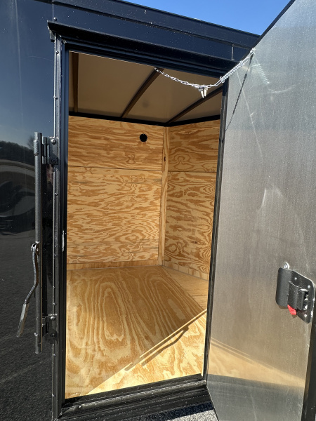 New 2026 7X16 QUALITY CARGO TANDEM AXLE ENCLOSED TRAILER WITH REAR SPOILER AND BLACKOUT PACKAGE