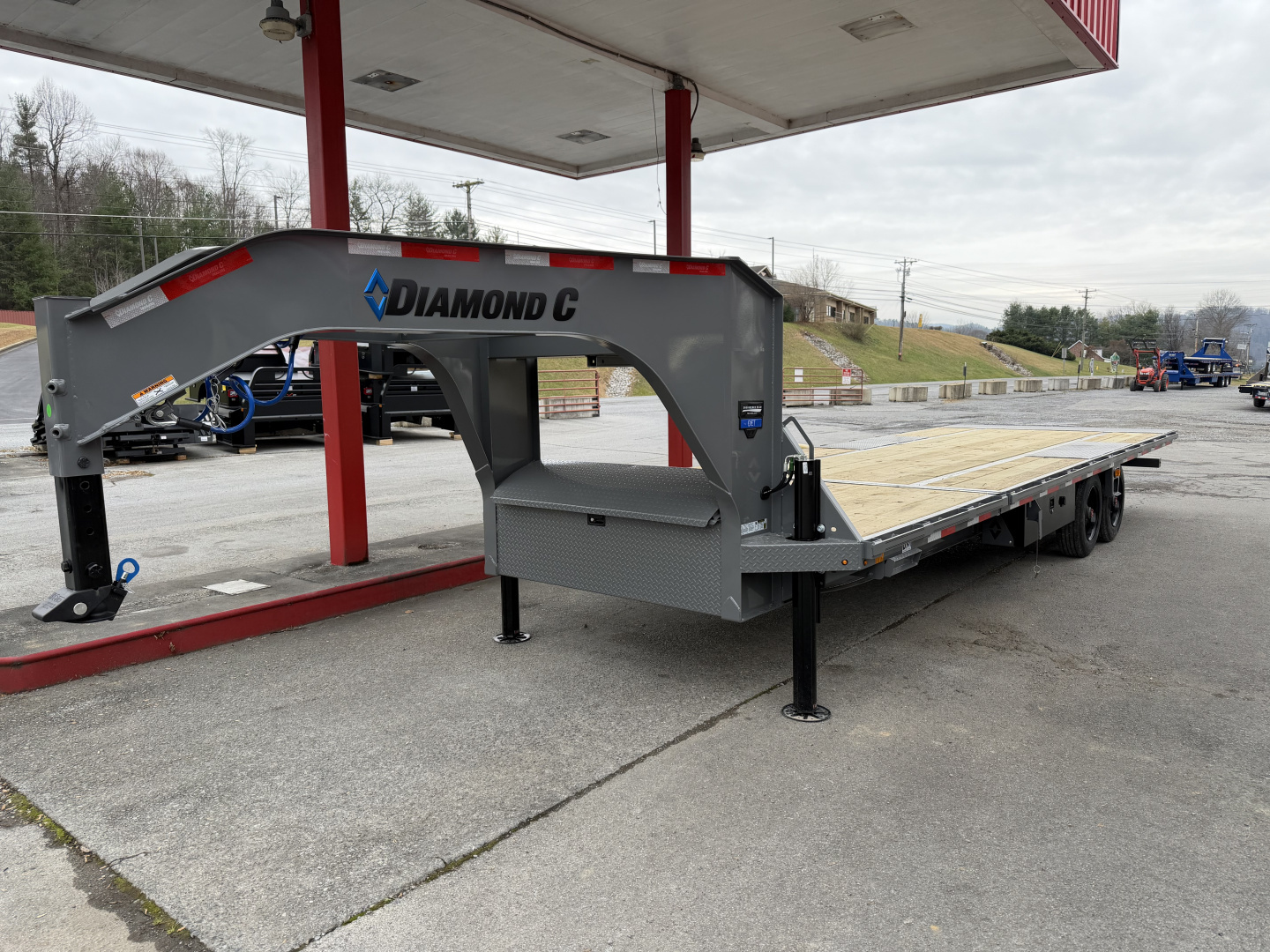 New 2026 Diamond C DET210 DECK OVER POWER TILT TRAILER WITH HYDRO JACKS & REMOTE