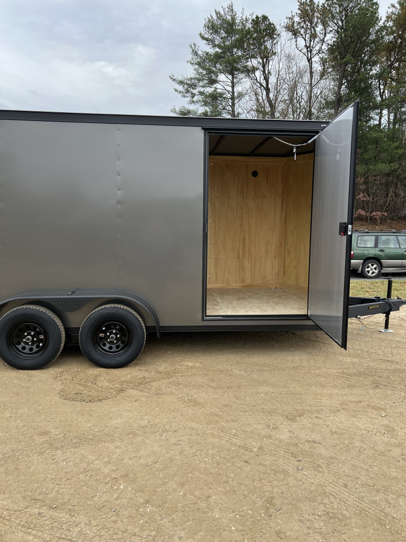 New 2026 Covered Wagon Trailers CW7X16TA2 Cargo / Enclosed Trailer / 7' Wide x 16' Long / 7' Interior Height / Ramp Rear Door , 48" Side door / 3500# Electric Brake Axles / .080 Poly Core Charcoal Gray with Black Out Package / Spoiler with load lights