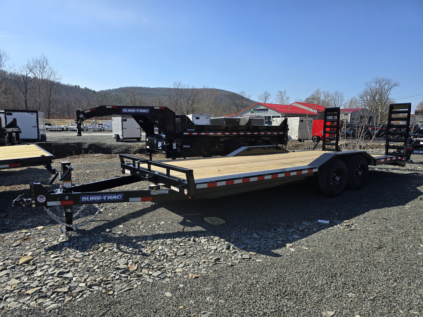 New 2026 Sure-Trac 8.5x20+2 Full Width Implement Trailer- HD Tube Bulkhead- Extended Tongue- Spare Tire Carrier- Stand Up Ramps with Adjustable Supports- Reinforced Diamond Plate Fenders- Pressure Treated Decking