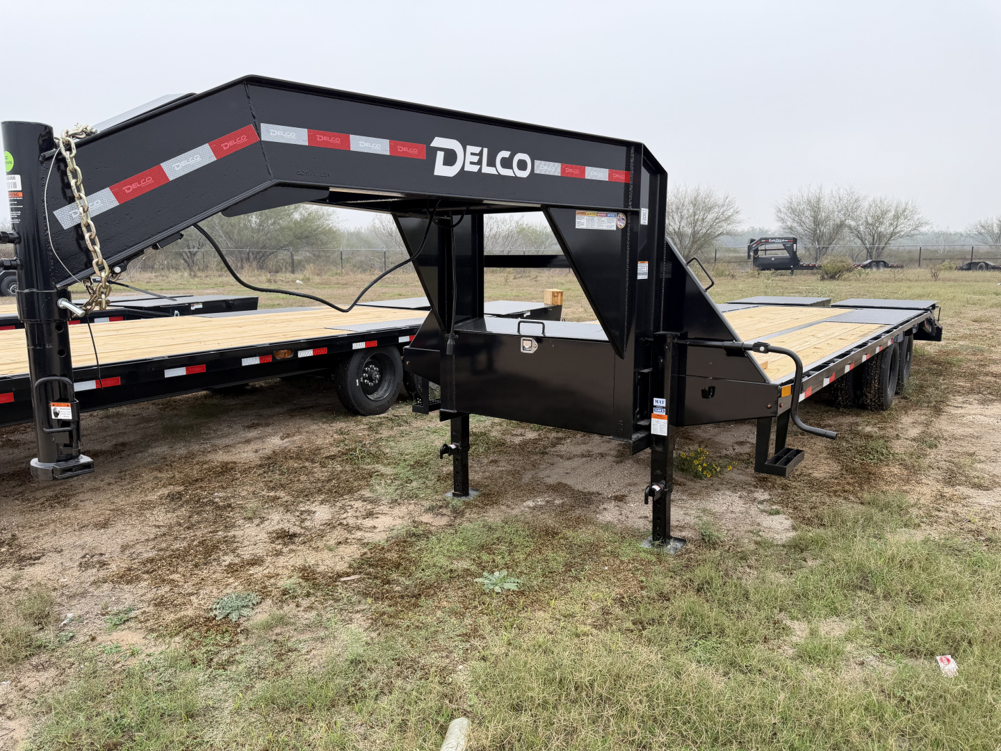 New 2026 Delco Trailers 102x25ft Flatbed Trailer 24k