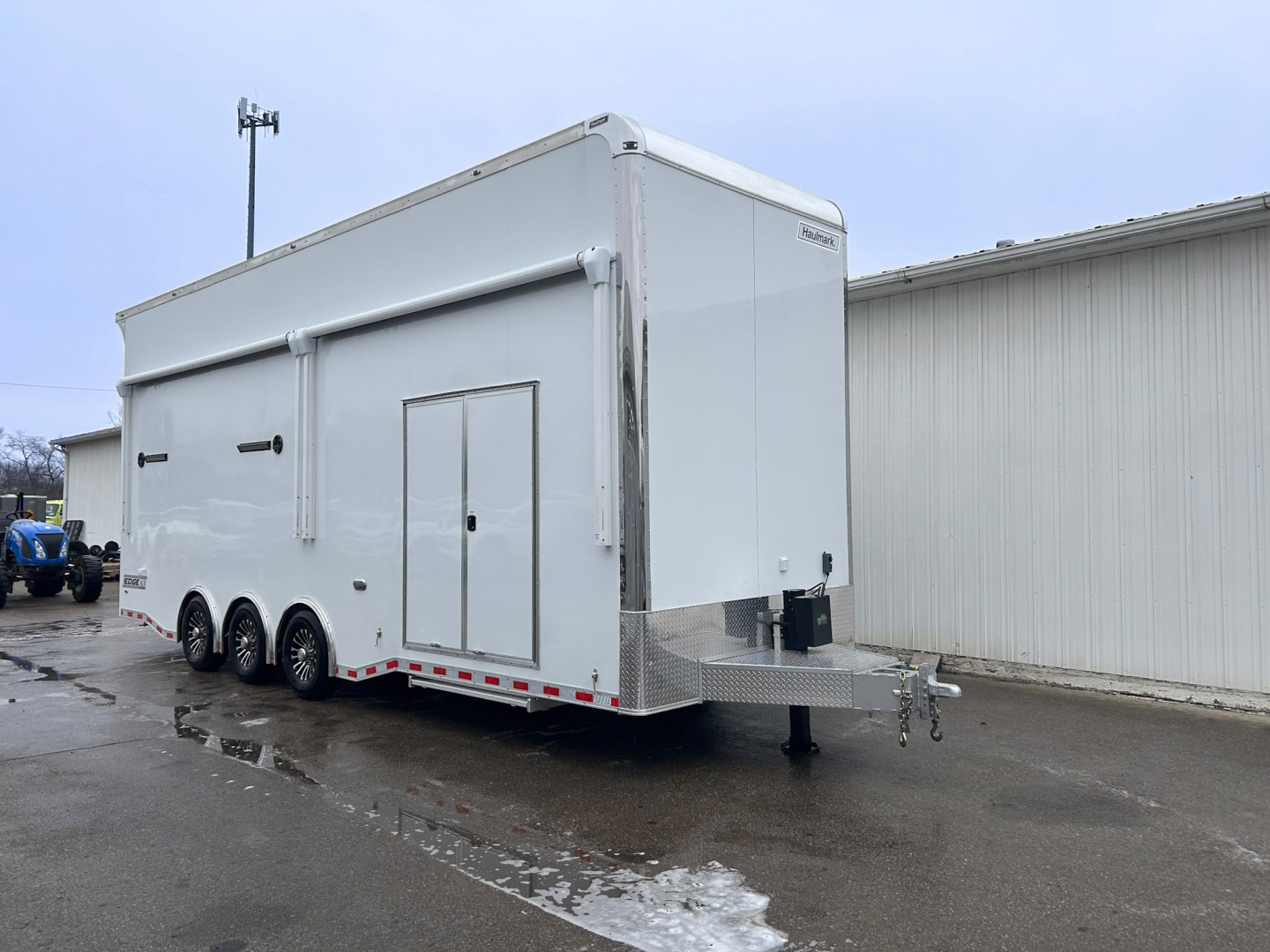 New 2026 Haulmark 28 FT EDGE ALUMINUM STACKER TRAILER W/ ESCAPE DOOR AND AWNINGS