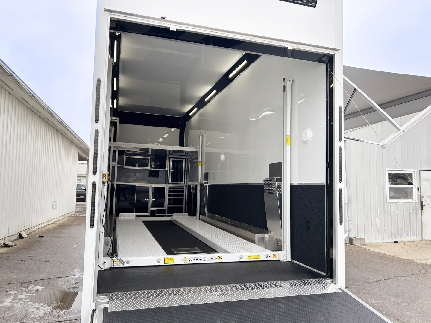 New 2026 Haulmark 28 FT EDGE ALUMINUM STACKER TRAILER W/ ESCAPE DOOR AND AWNINGS