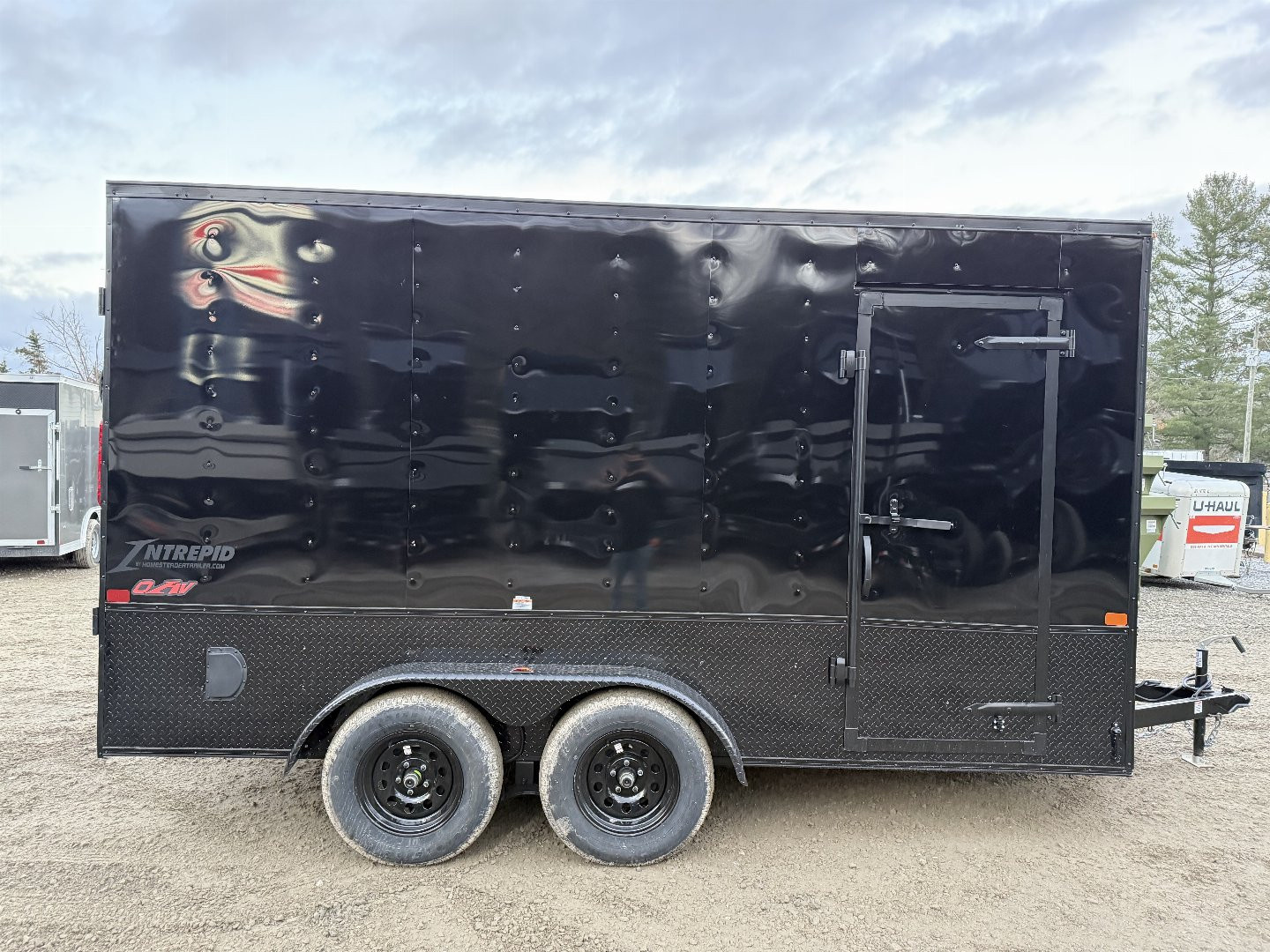 New 2026 Homesteader Trailers / 714IT Intrepid OHV / 7' Interior Height / .030 Black Aluminum w/ Black Out Pkg / Ramp Rear Door / 32" Side Door / 4-Recessed Floor D-Rings / ATP 24" High on sides and ramp door