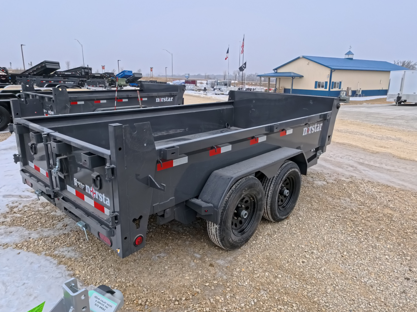 New 2026 Norstar 72x12 DCB Dump Trailer, 9,900lb GVWR, Scissor Lift, Slide-In Ramps, and Tarp Kit