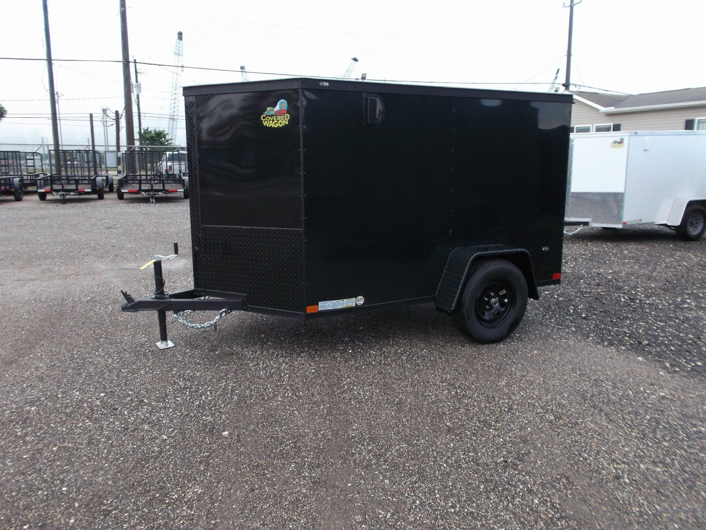 New 2026 Covered Wagon Trailers 5x8 Cargo Trailer / Enclosed Trailer / Ramp / Side Door / .030 Black Semi-Screwless Exterior / Bed Lined Tongue and Frame / Black Out Package