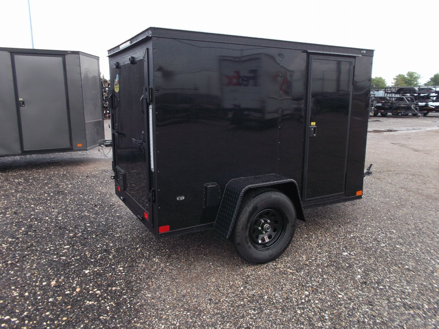 New 2026 Covered Wagon Trailers 5x8 Cargo Trailer / Enclosed Trailer / Ramp / Side Door / .030 Black Semi-Screwless Exterior / Bed Lined Tongue and Frame / Black Out Package