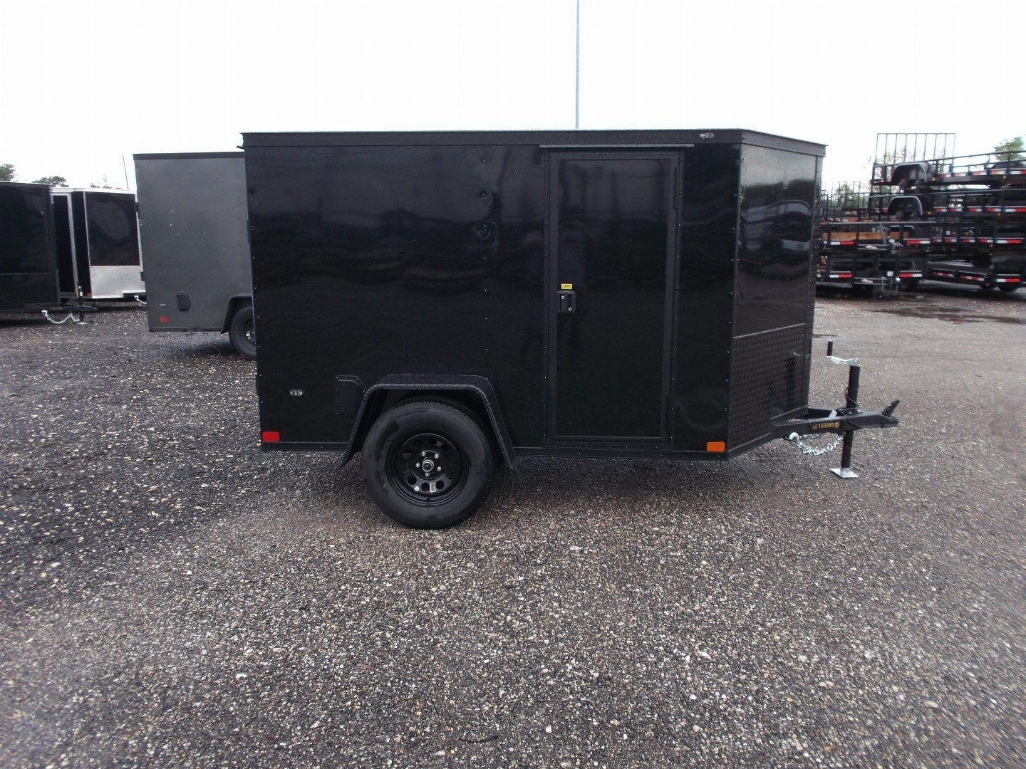 New 2026 Covered Wagon Trailers 5x8 Cargo Trailer / Enclosed Trailer / Ramp / Side Door / .030 Black Semi-Screwless Exterior / Bed Lined Tongue and Frame / Black Out Package