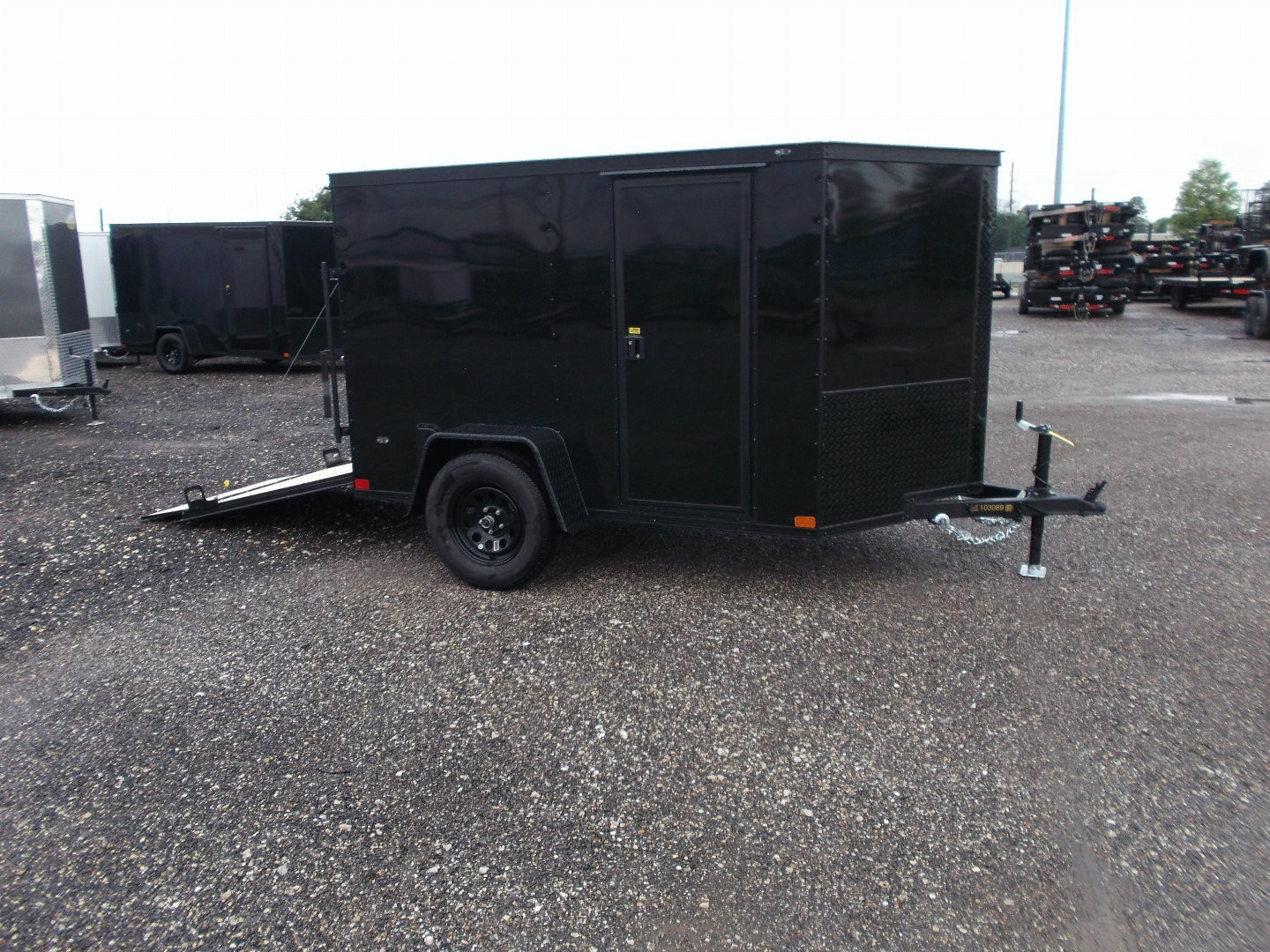New 2026 Covered Wagon Trailers 5x8 Cargo Trailer / Enclosed Trailer / Ramp / Side Door / .030 Black Semi-Screwless Exterior / Bed Lined Tongue and Frame / Black Out Package