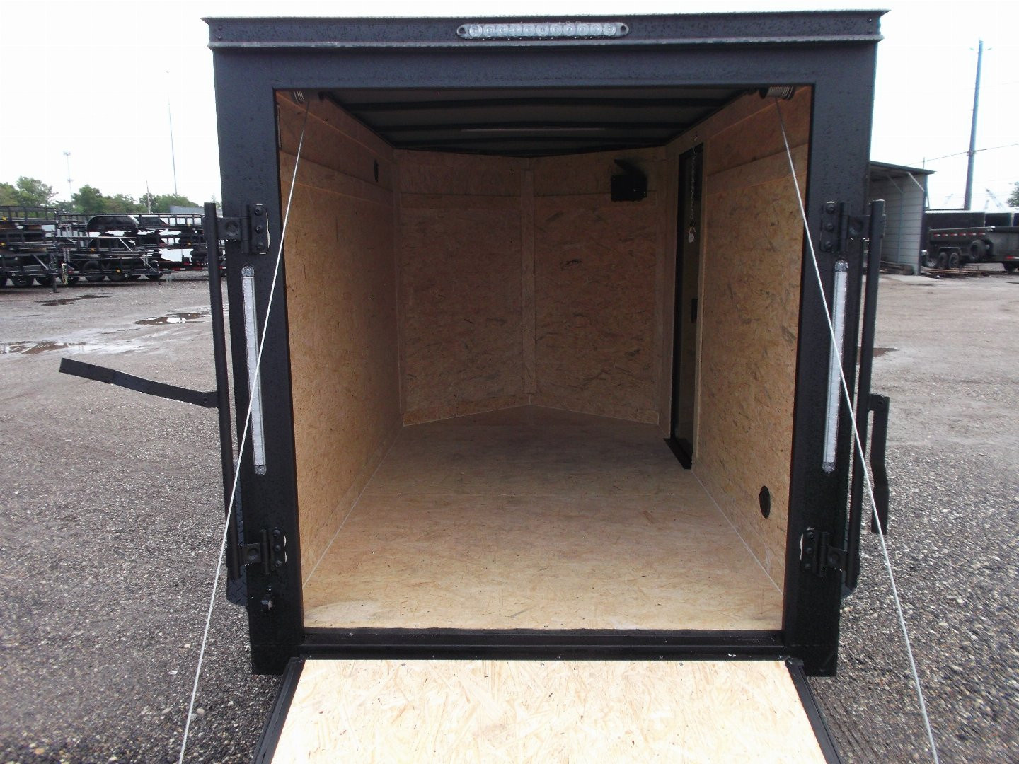 New 2026 Covered Wagon Trailers 5x8 Cargo Trailer / Enclosed Trailer / Ramp / Side Door / .030 Black Semi-Screwless Exterior / Bed Lined Tongue and Frame / Black Out Package