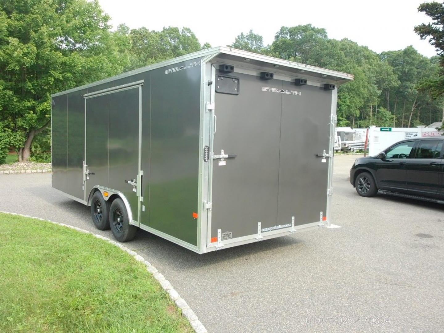 New ALCOM STEALTH CAR TRAILER, 8.5X20 V nose, with options. Finished Interior, Cabinets, 9,990 lb. GVWR, our ID#150954 Sale $22,500