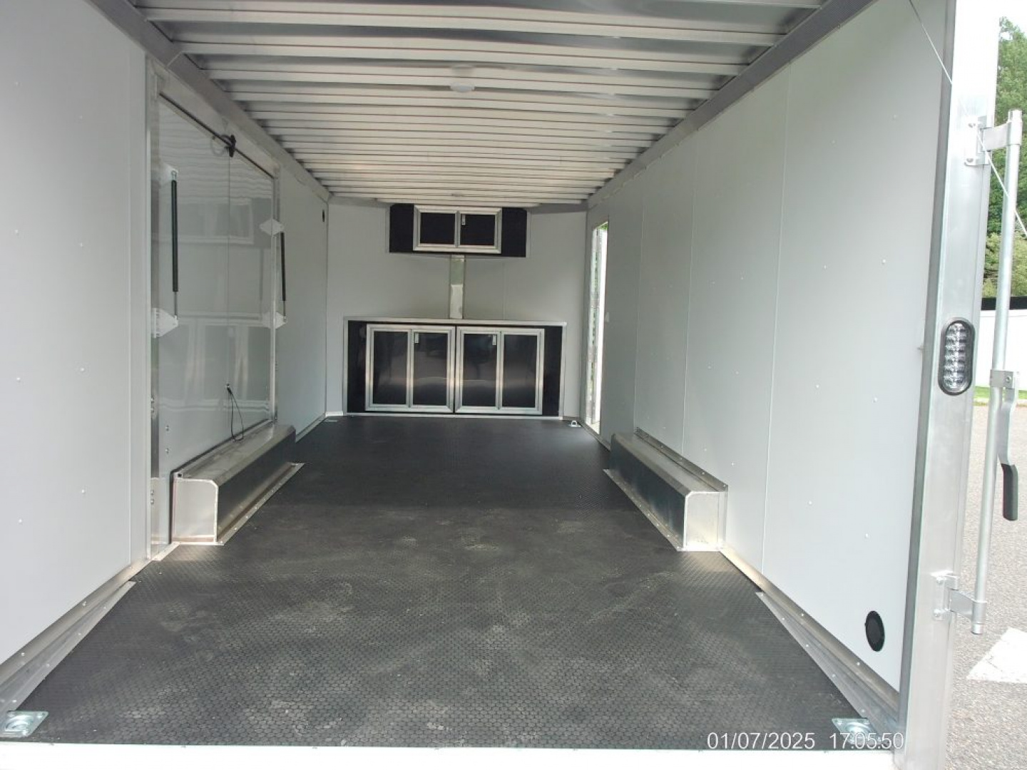 New ALCOM STEALTH CAR TRAILER, 8.5X20 V nose, with options. Finished Interior, Cabinets, 9,990 lb. GVWR, our ID#150954 Sale $22,500
