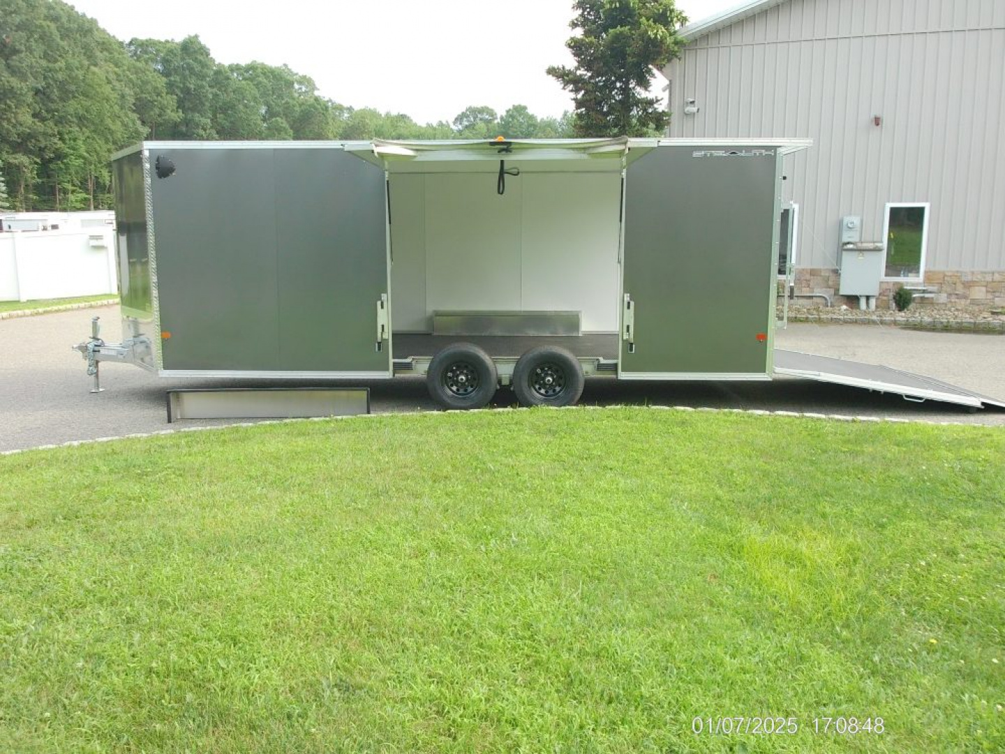 New ALCOM STEALTH CAR TRAILER, 8.5X20 V nose, with options. Finished Interior, Cabinets, 9,990 lb. GVWR, our ID#150954 Sale $22,500