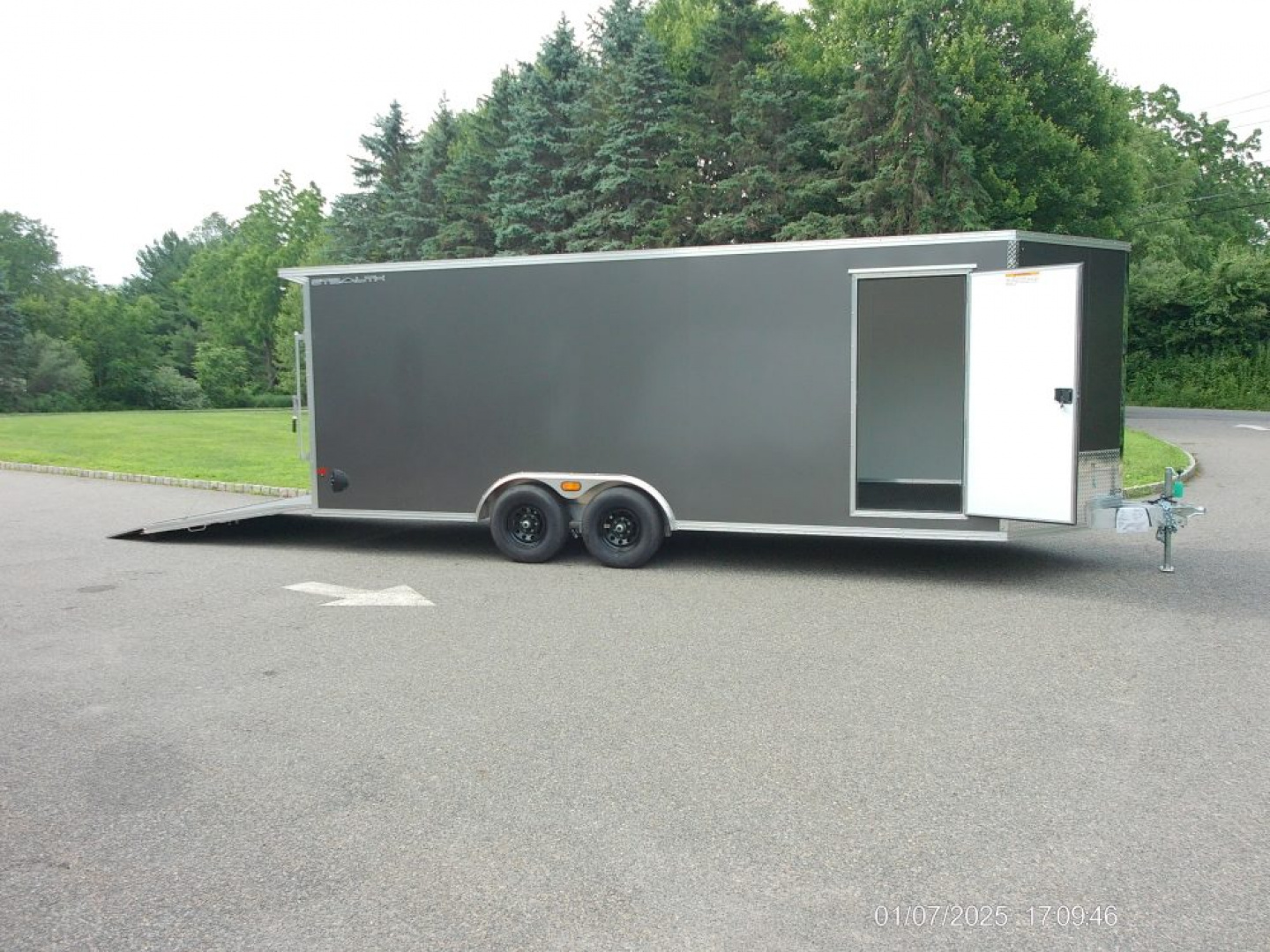 New ALCOM STEALTH CAR TRAILER, 8.5X20 V nose, with options. Finished Interior, Cabinets, 9,990 lb. GVWR, our ID#150954 Sale $22,500