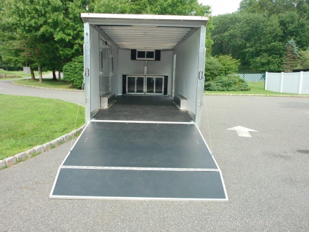New ALCOM STEALTH CAR TRAILER, 8.5X20 V nose, with options. Finished Interior, Cabinets, 9,990 lb. GVWR, our ID#150954 Sale $22,500