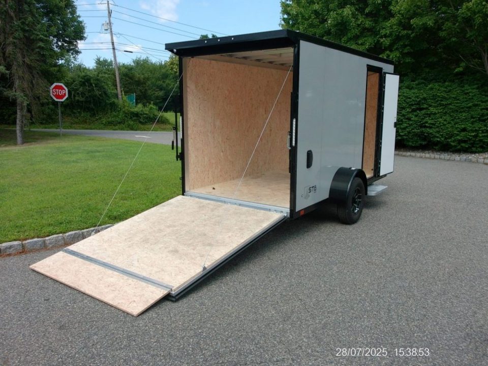 New EXAMPLE / ATC 6X12 with 6'6" interior height, black trim, electric brakes, rear spoiler, battery and lights, step at side door. ID#235268 , $9,695.00