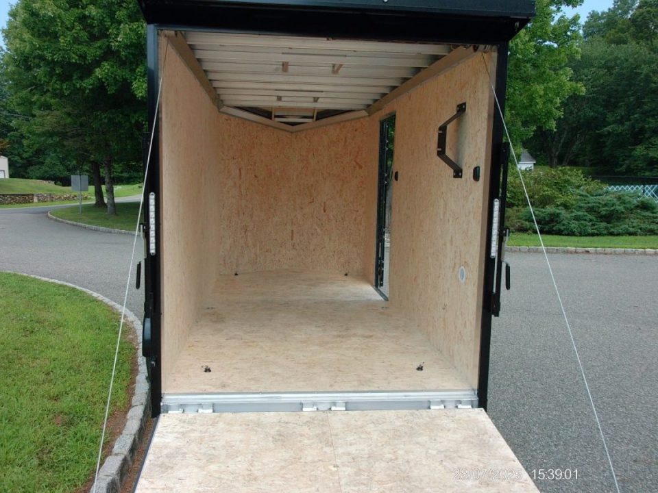 New EXAMPLE / ATC 6X12 with 6'6" interior height, black trim, electric brakes, rear spoiler, battery and lights, step at side door. ID#235268 , $9,695.00
