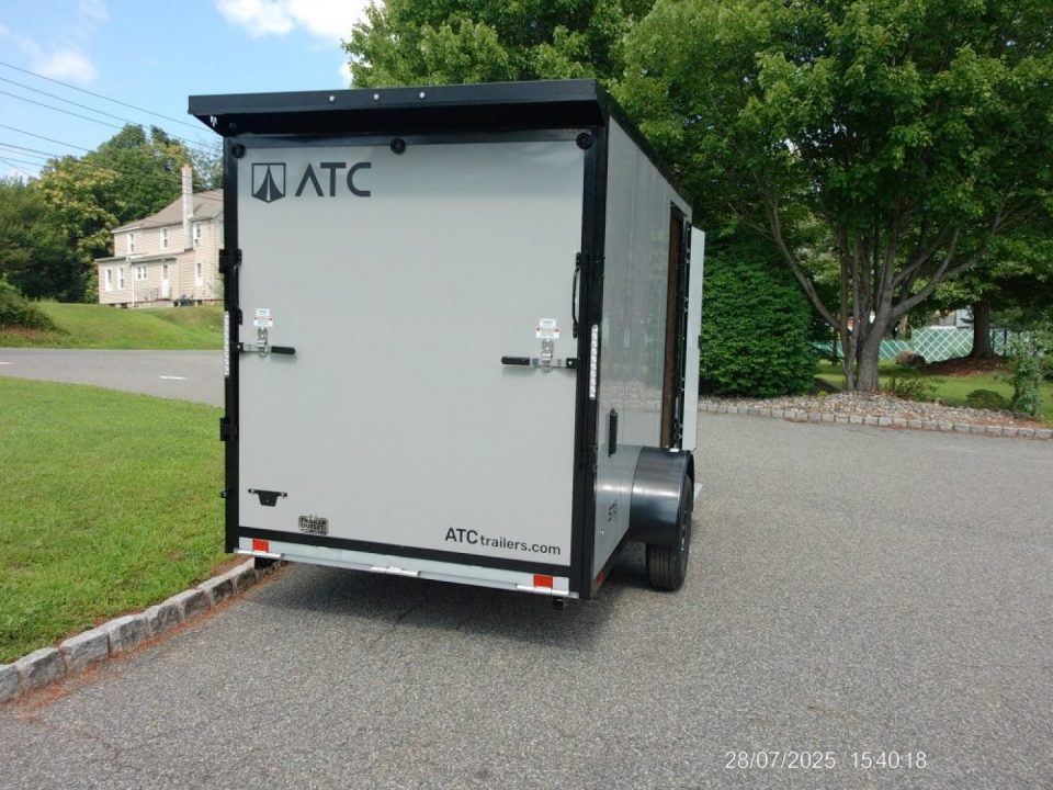 New EXAMPLE / ATC 6X12 with 6'6" interior height, black trim, electric brakes, rear spoiler, battery and lights, step at side door. ID#235268 , $9,695.00