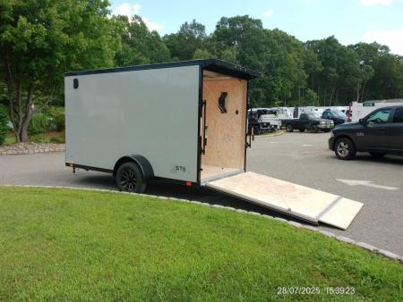 New EXAMPLE / ATC 6X12 with 6'6" interior height, black trim, electric brakes, rear spoiler, battery and lights, step at side door. ID#235268 , $9,695.00