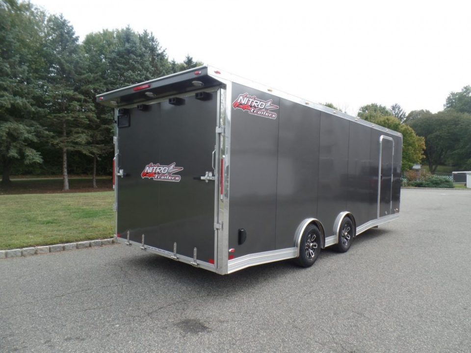 New EXAMPLE / NITRO BRAND 8.5X24 Enclosed Cast Corner Body Style Enclosed Car Trailer, with Options. Big Escape Door, Finished Interior, Cabinets, ID#009489