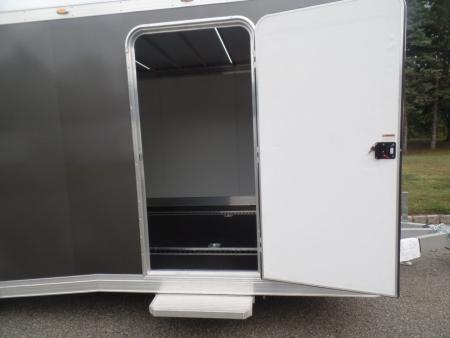 New EXAMPLE / NITRO BRAND 8.5X24 Enclosed Cast Corner Body Style Enclosed Car Trailer, with Options. Big Escape Door, Finished Interior, Cabinets, ID#009489