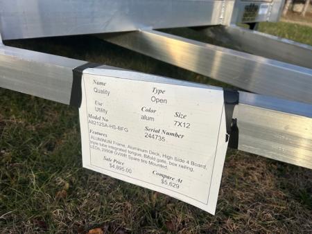 New QUALITY S&A BRAND ,  7 X 12 open utility trailer, Aluminum Frame and Deck, 2 ft. high sides, Bi-fold Ramp, 2,990 GVWR, 830 lbs. empty weight. ID#244735