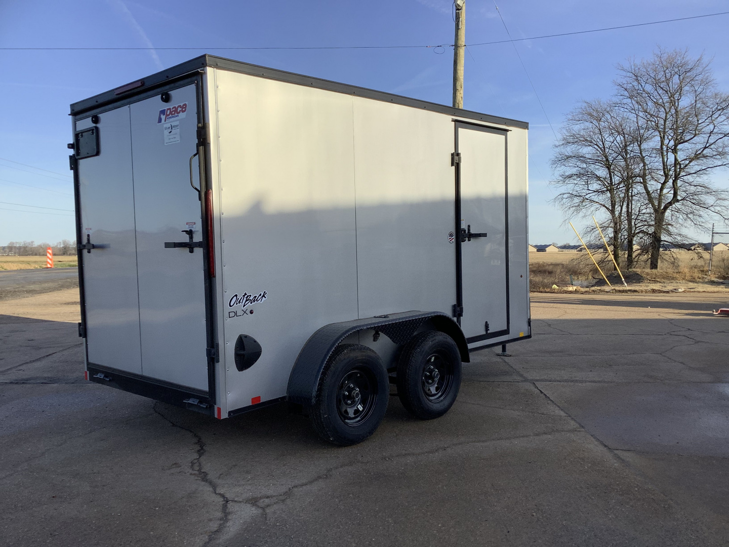 New 2026 Pace American Outback Deluxe 6x12 (7K) Tandem Axle Enclosed Cargo Trailer