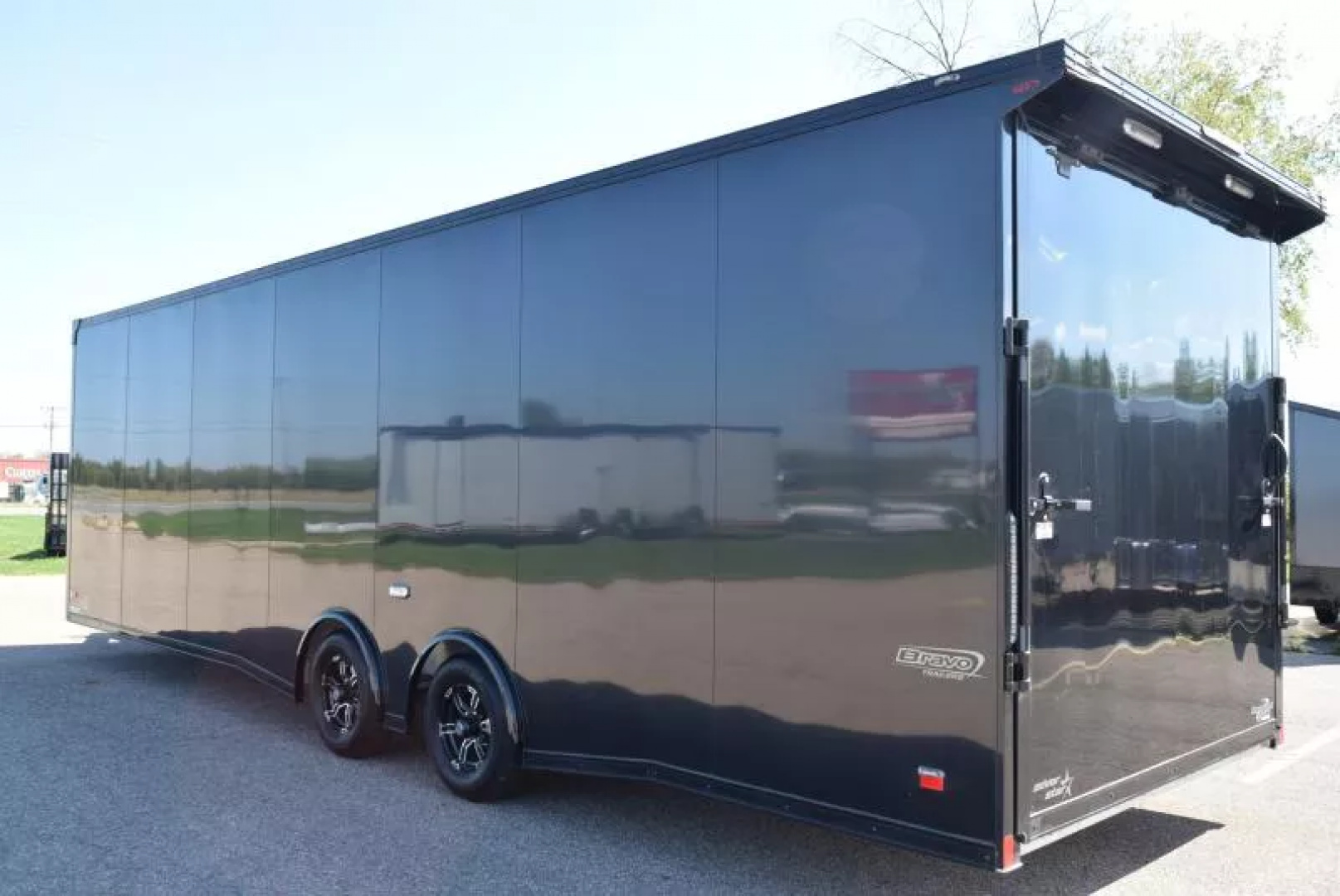 Used PRE-OWNED 2023 BRAVO 8.5x28 SILVER STAR ALUMINUM ENCLOSED CAR HAULER