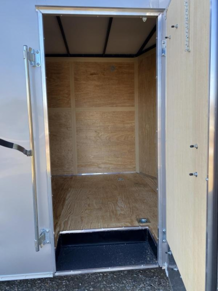 New 2026 Homesteader 8.5 x 20 Intrepid V-Nose Car Hauler w/ Ramp Door