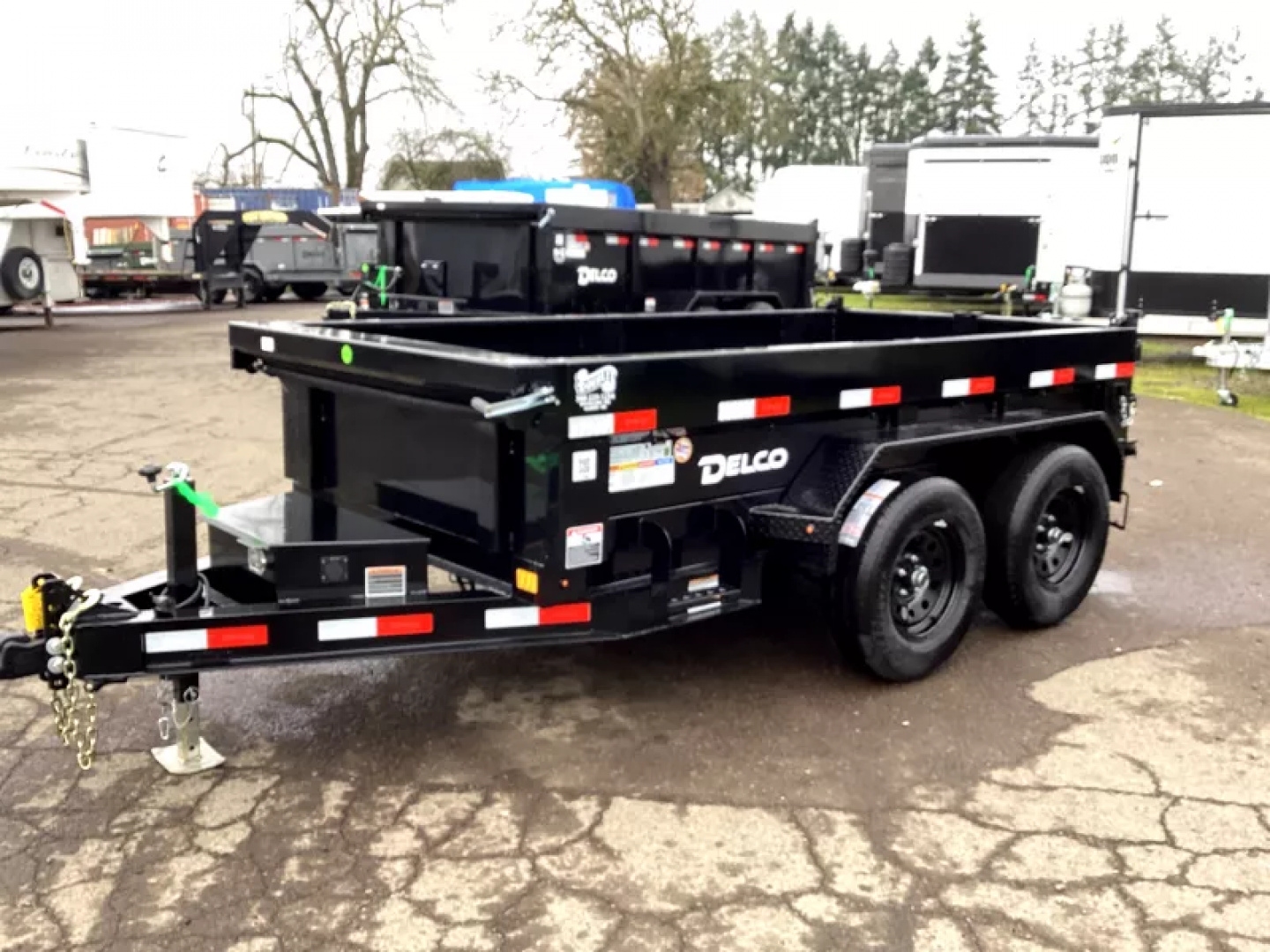 New 2026 Delco Dump Trailer 5x10 7K - Spreader gate - 18" sides - slide in ramps Dump Trailer