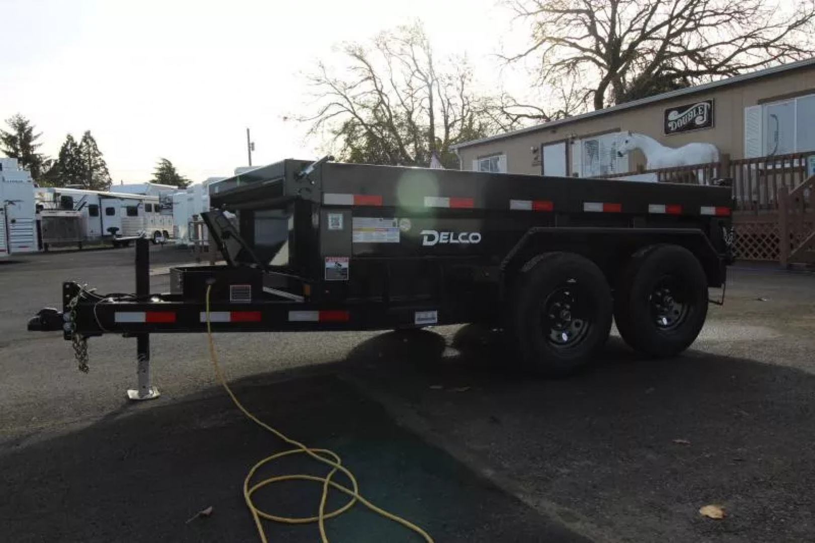 New 2026 Delco Dump Trailer 5x10 7K - Spreader gate - 18" sides - slide in ramps Dump Trailer