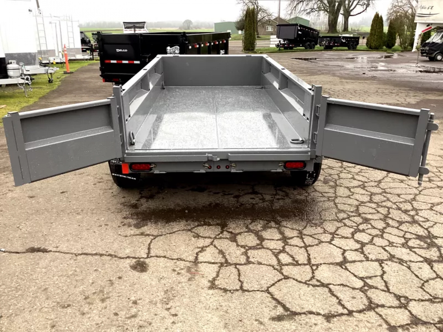 New 2026 Delco Trailers Dump Trailer 5x10 7K - Spreader gate - Jet Grey - 18" sides - slide in ramps Dump Trailer