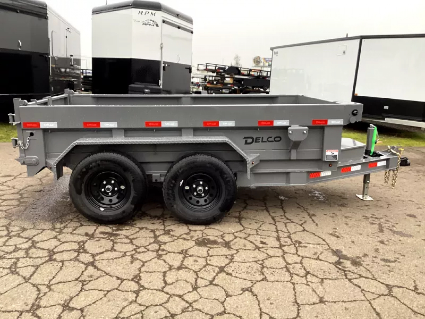 New 2026 Delco Dump Trailer 5x10 7K - Spreader gate - Jet Grey - 18" sides - slide in ramps Dump Trailer